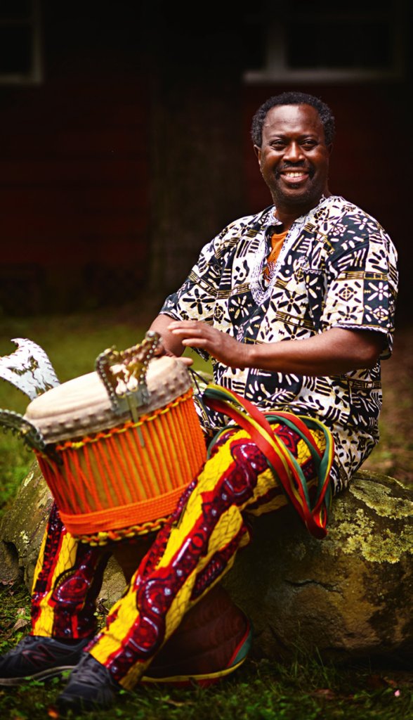 MOUSSA TRAORÉ playing a drum
