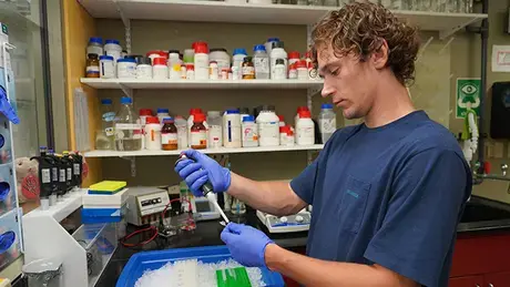 Konnor Collins works in the Aquatic Diagnostic Lab.