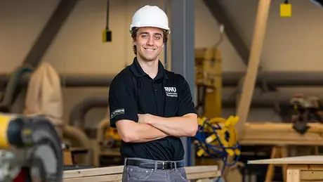 Max Collins stands in the SECCM lab.