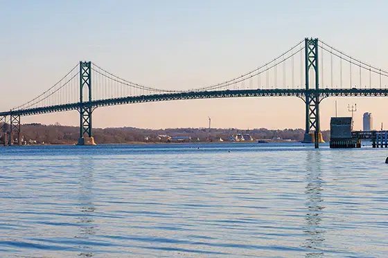 image of Mount Hope Bridge over tranquil waters from RWU's Bristol campus
