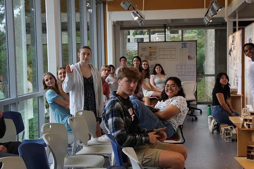 Summer Academy students waiting for presentations to start in the gallery