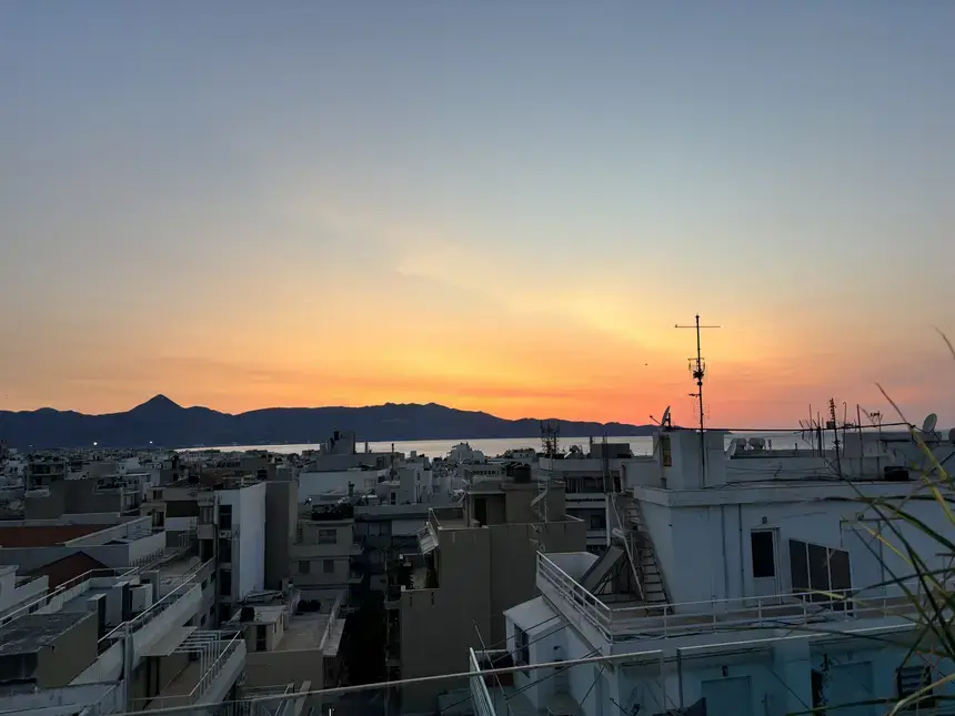 A photo of sunset over a Greek town