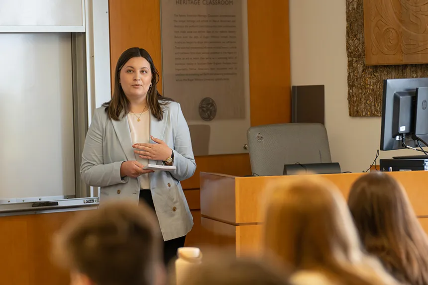 A student presenting in front of a class at SASH.