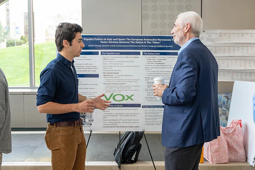 A student talks with a dean at SASH.