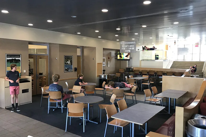 A digital art photoshop of a student in the RWU Lower Commons