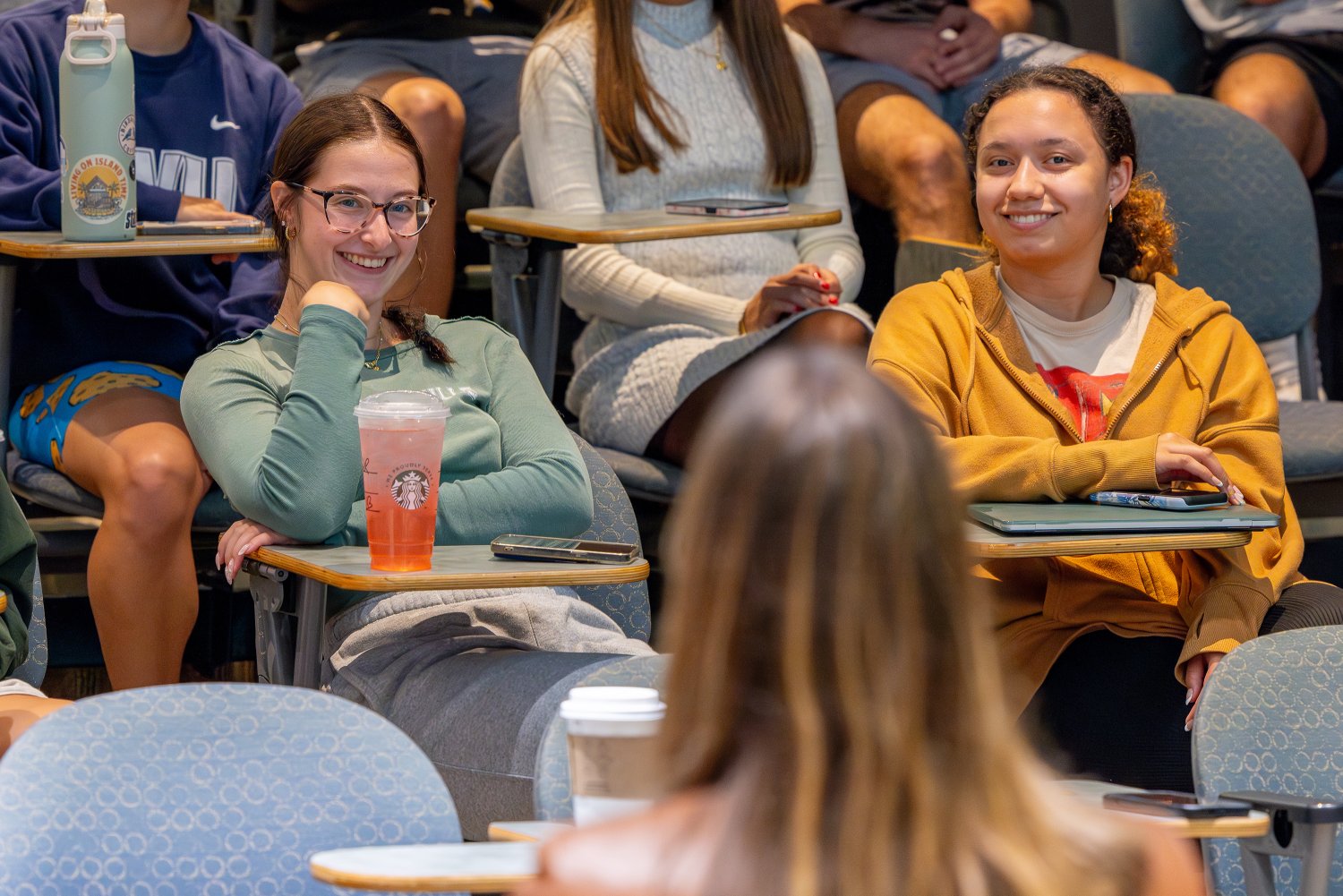 Students listen attentively as RWU alumni share their professional journey and industry insights.