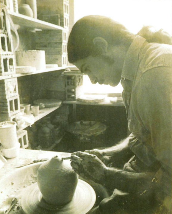 In an earlier photo, Denis Leonti shapes clay at the wheel.