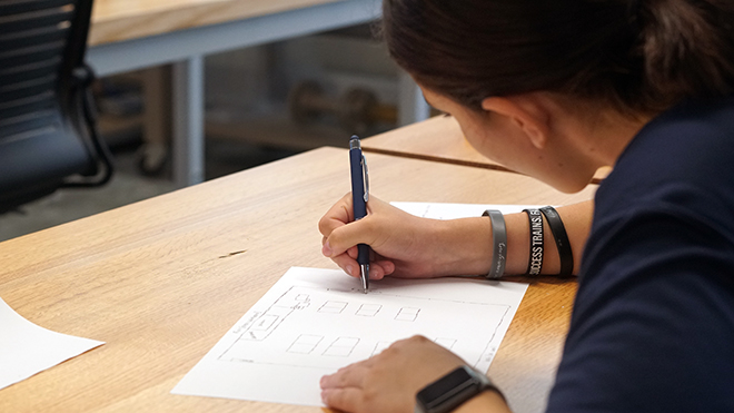 A student sketches a crime scene 