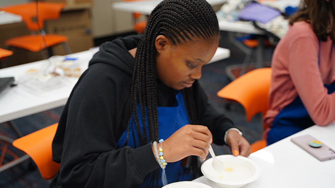 A student works on an experiment at the Food Science Camp