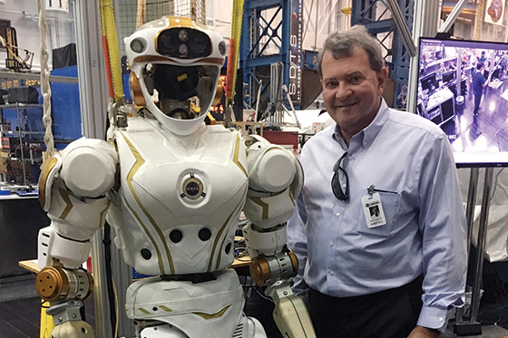 President Miaoulis with a robot