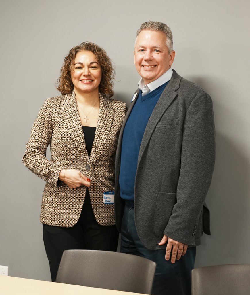 Dean Gena Bianco and Chief of Staff Brian Williams celebrate her recognition.