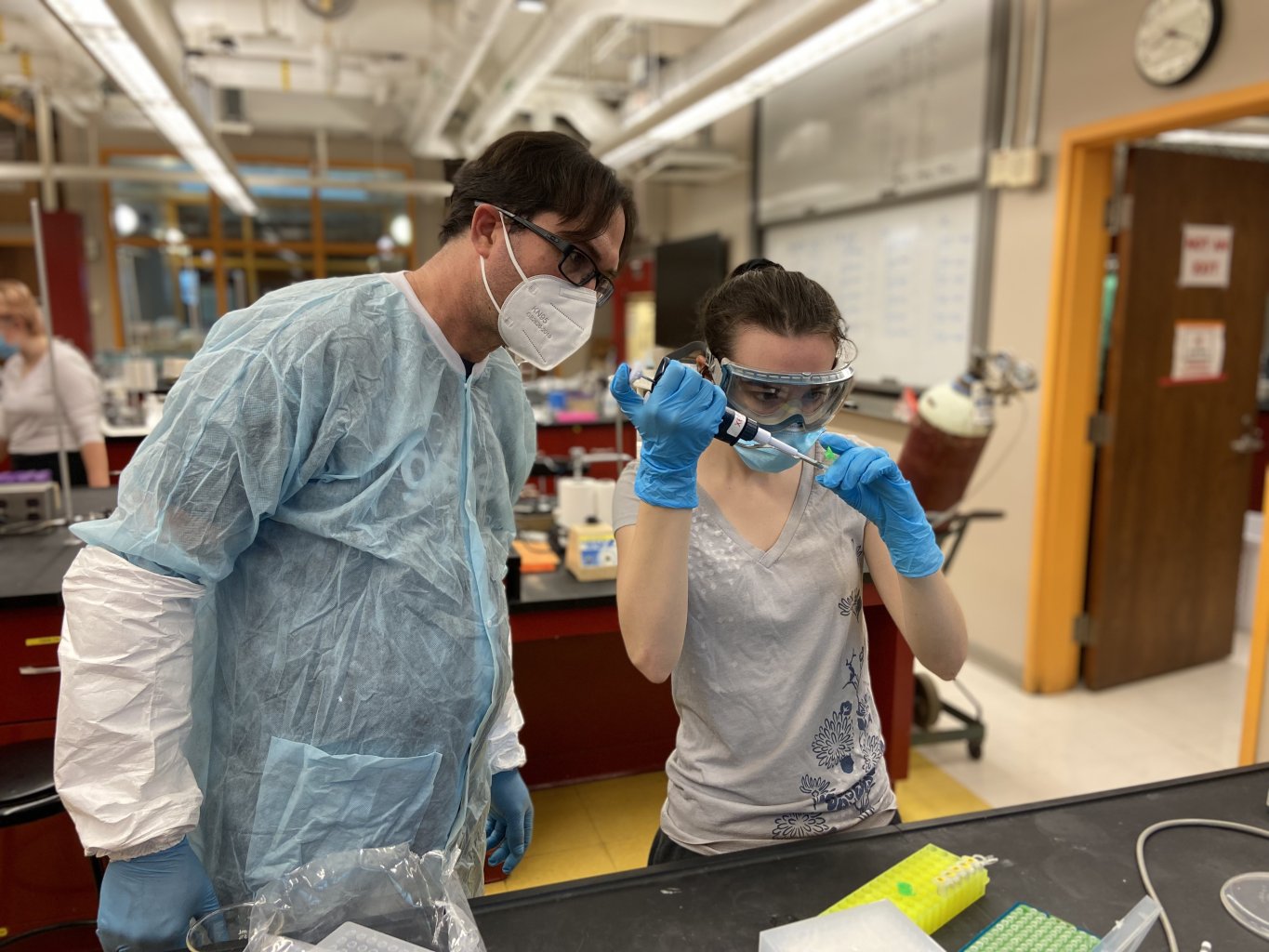 Andrew Rhyne and Julia Dwyer '22 work together to create the first viable test to determine if marine fish were captured using cyanide.