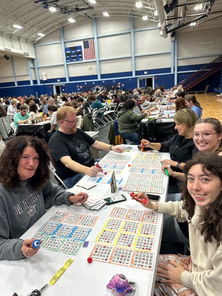 Students and their families engage in Family Bingo in the Upper Gym of the Campus Recreation Center.