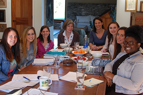 fellows sit around a table