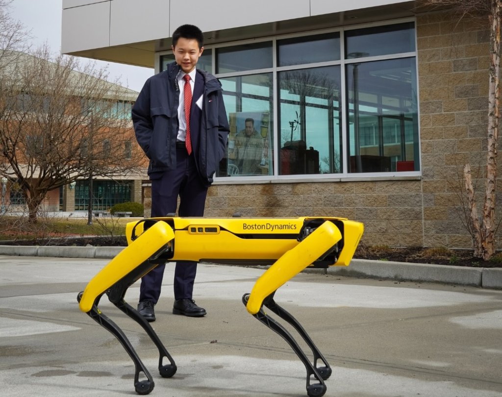 JSHS participant watches Boston Dynamics "Spot" dog dance.