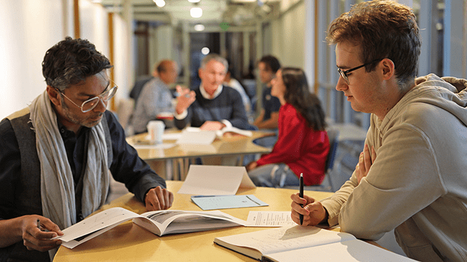 Adjunct faculty and critics reviewing student portfolios and resumes