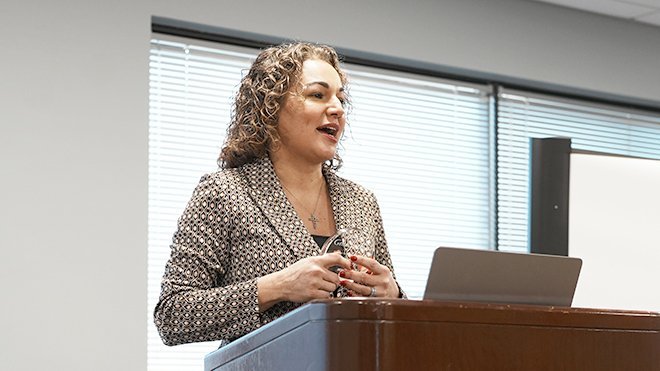 Dean Gena Bianco of RWU Extension School speaks at the Providence campus after receiving the Education for Freedom Award from the Reentry Campus Program.