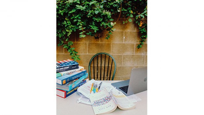 desk with books on it