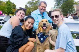 The President, Roger and Student in a group pose.