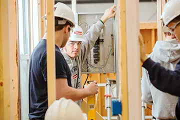 Students working on construction project.