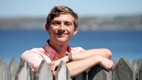 Connor Huntley poses on the shores of the Mount Hope Bridge.