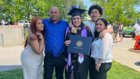 Maria Tavera ’22 and her family celebrating her graduation from RWU.