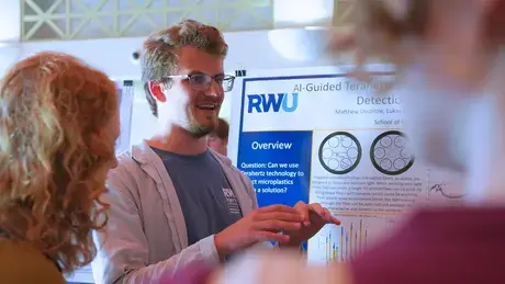 Junior Matthew Doolittle shares his findings with peers and faculty during the Summer Research Showcase.