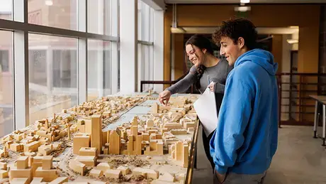 Architecture students look at their work