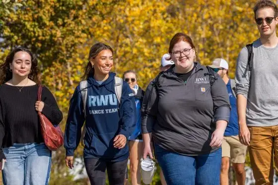 Smiling students walking together on campus