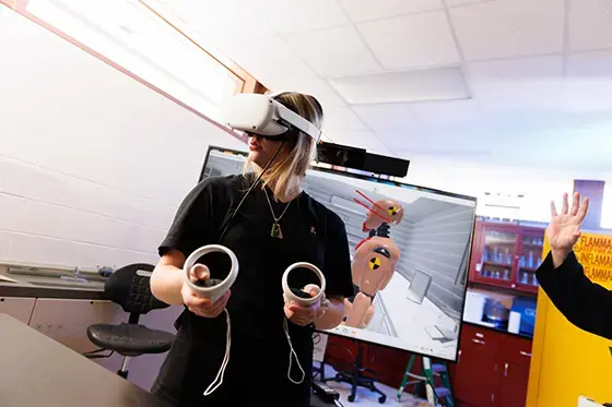 A student explores a crime scene using virtual reality
