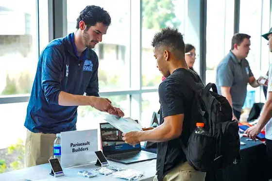 A student gets information at an internship fair