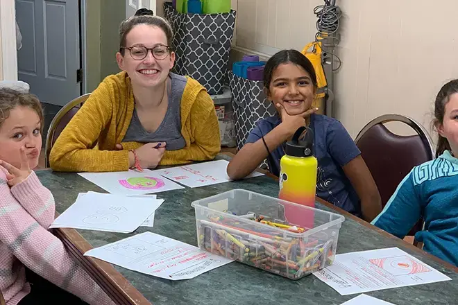 A student interns at Girls, Inc.