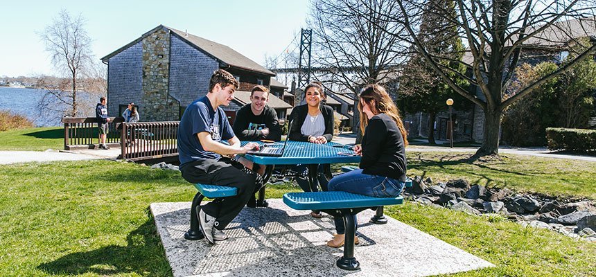 Students sitting at outdoor table