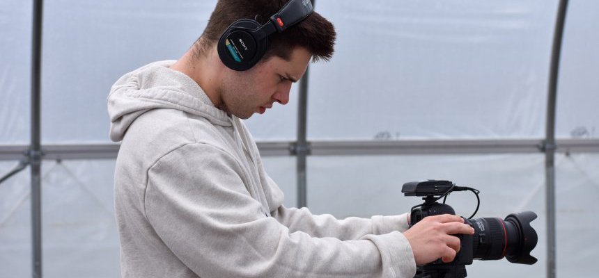 Student taking a video with a camera