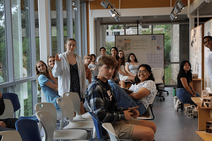 Summer Academy students waiting for presentations to start in the gallery