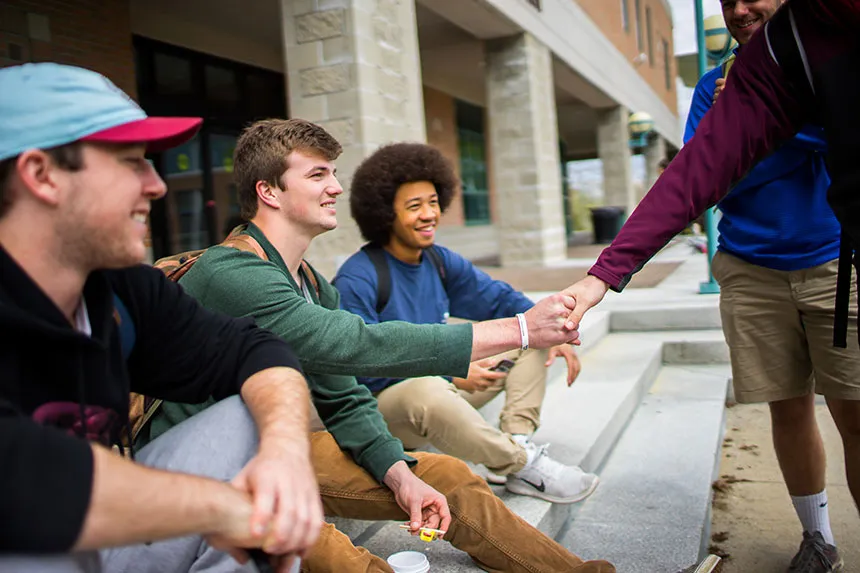 Students sitting ons stairs