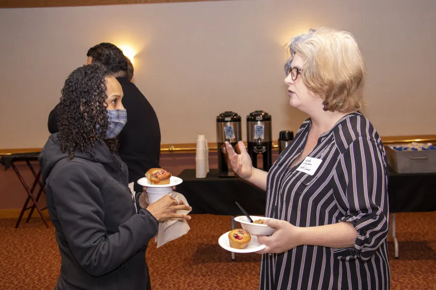 Students have a conversation at the 2022 RIASPA Conference at RWU