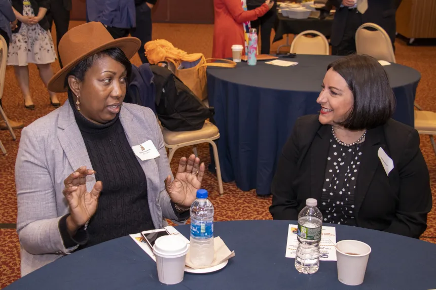 Students have a conversation at the 2022 RIASPA Conference at RWU