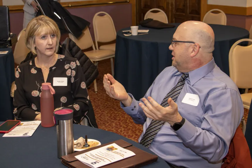 Students have a conversation at the 2022 RIASPA Conference at RWU