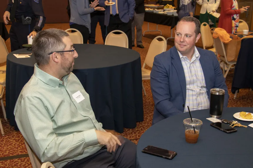 Students have a conversation at the 2022 RIASPA Conference at RWU