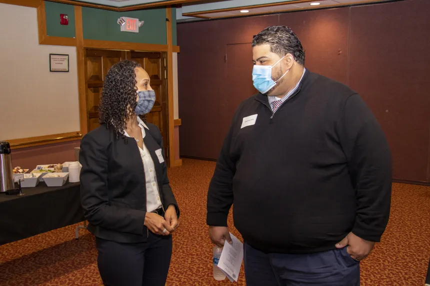 Students have a conversation at the 2022 RIASPA Conference at RWU