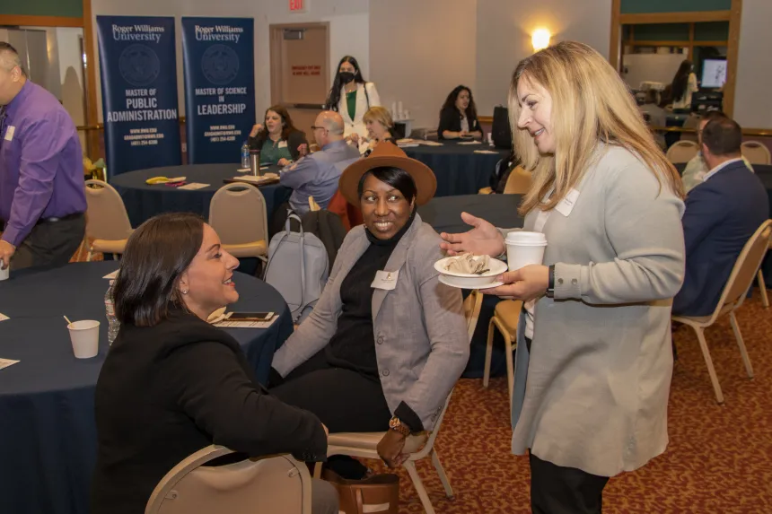 Students have a conversation at the 2022 RIASPA Conference at RWU