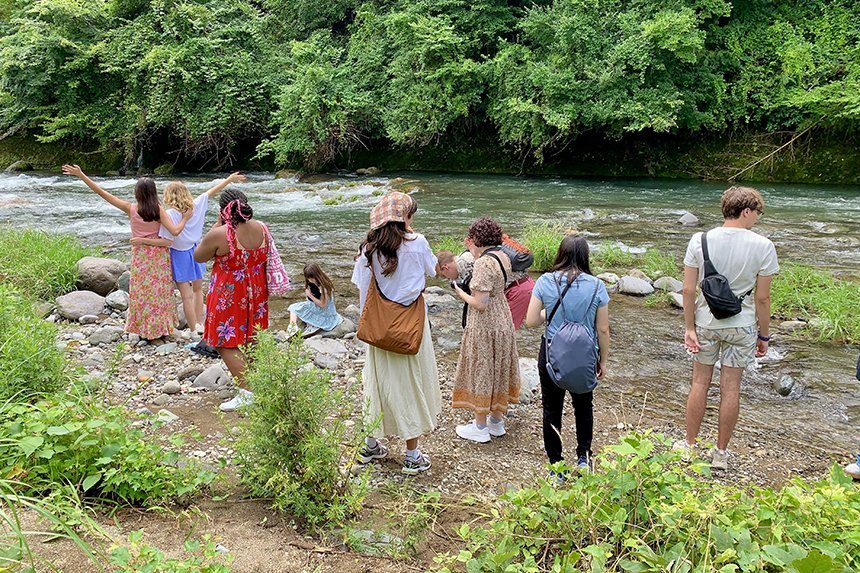 Students outside exploring a river