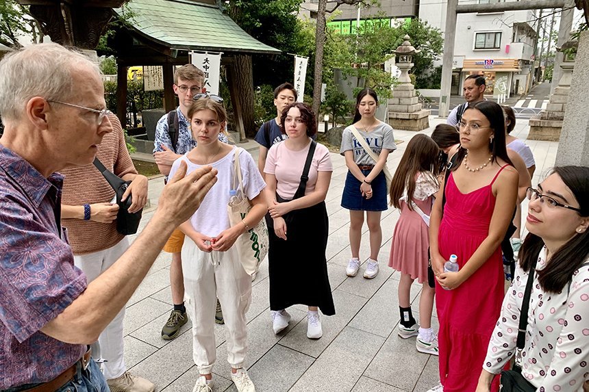 Students talk with Mark Davidson and Risa in Tokyo