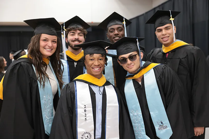 Graduates pose together