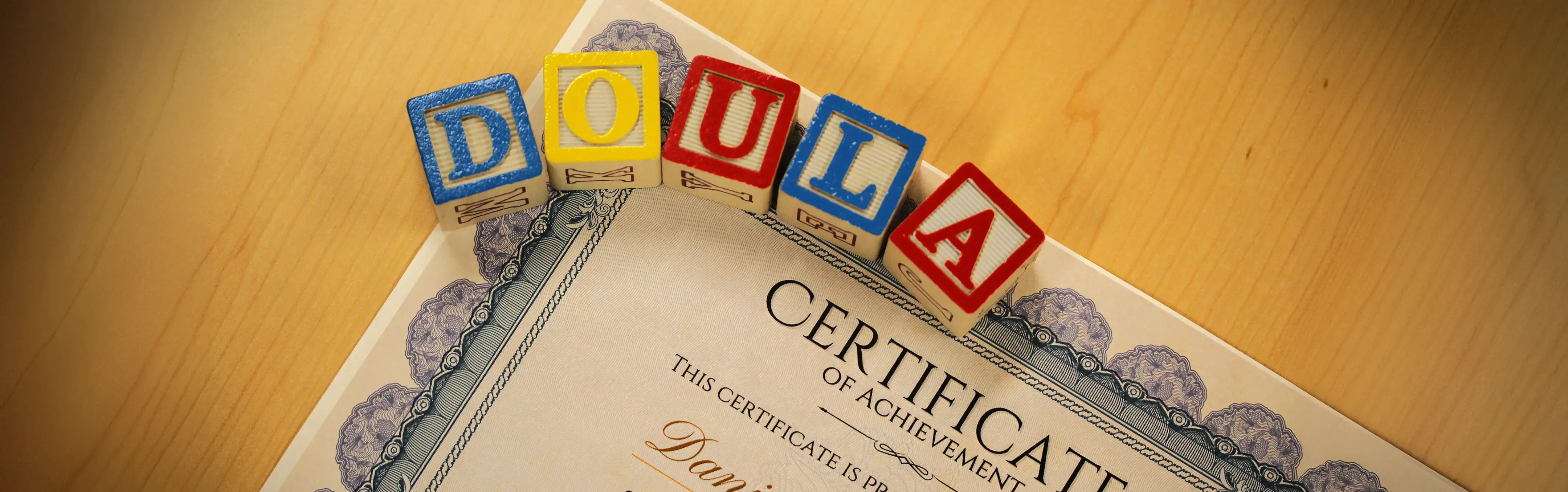 The word doula spelled out in children's blocks