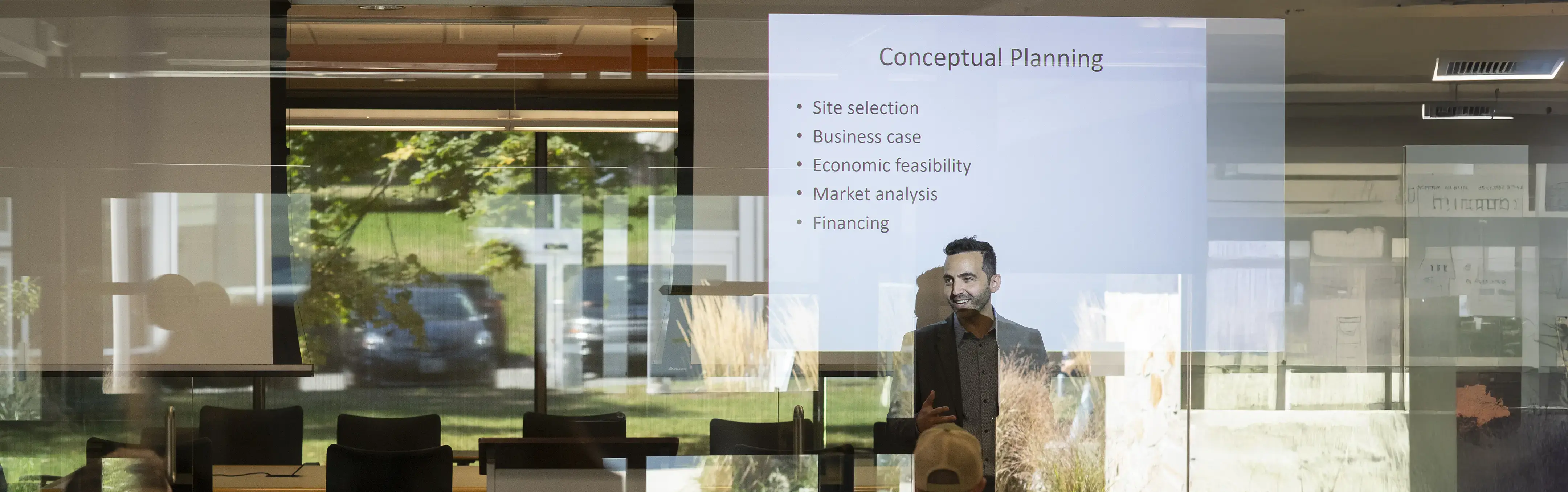 A professor teaches Community Develpment prinicipals to a classroom of students