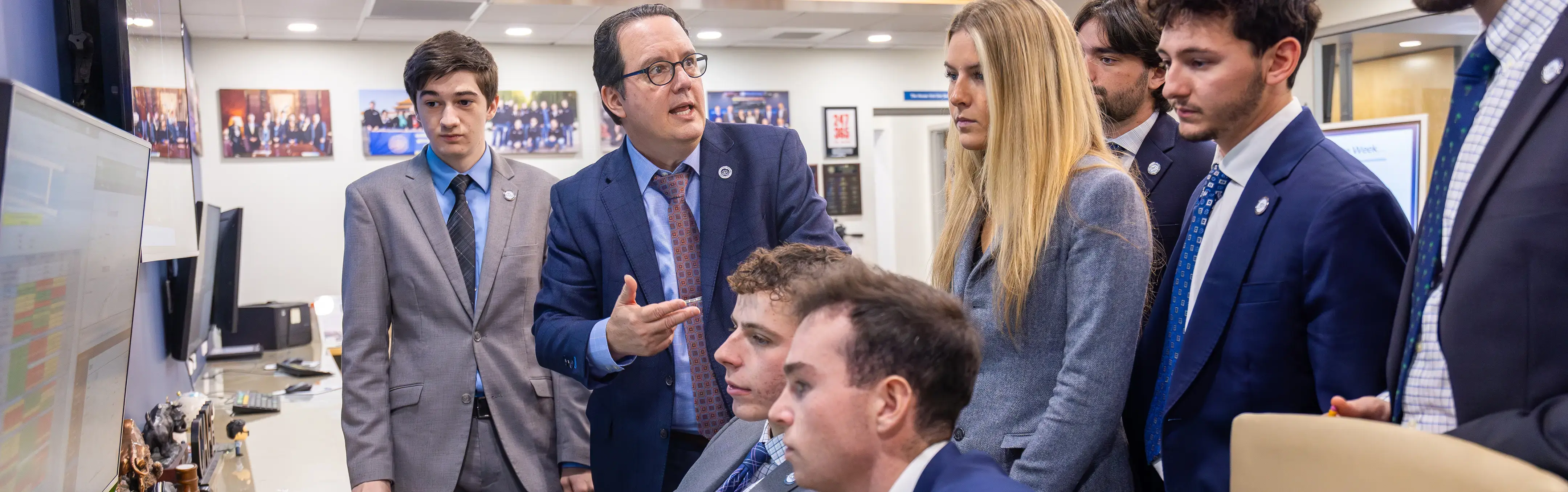 A professor works with students