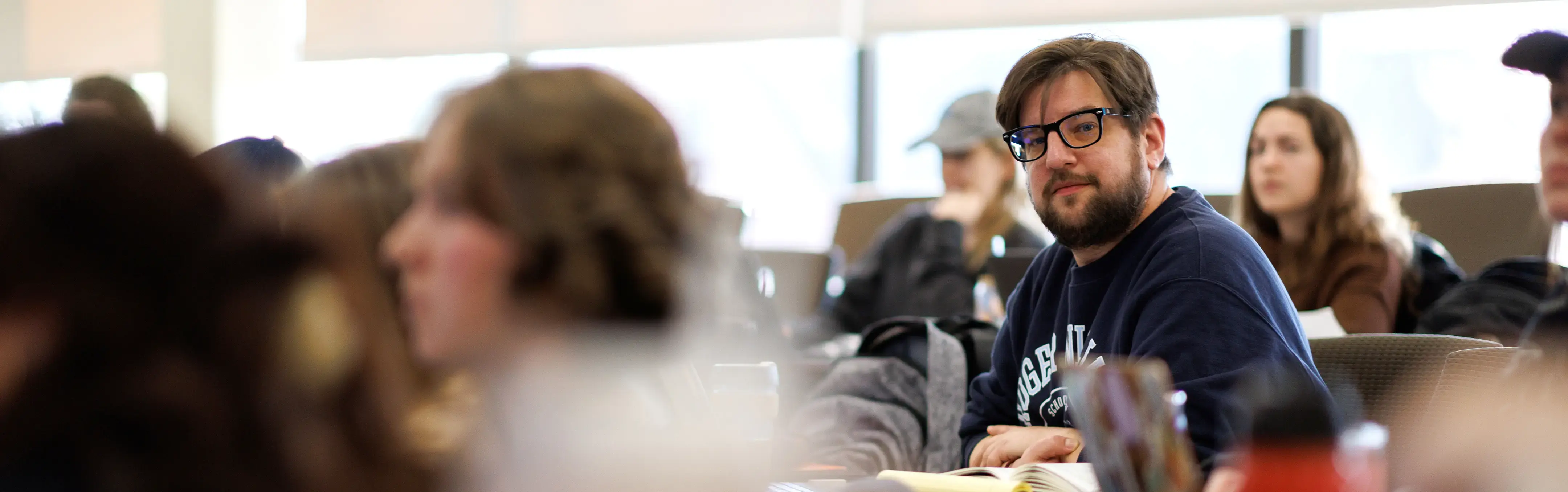 A student listens in a classroom
