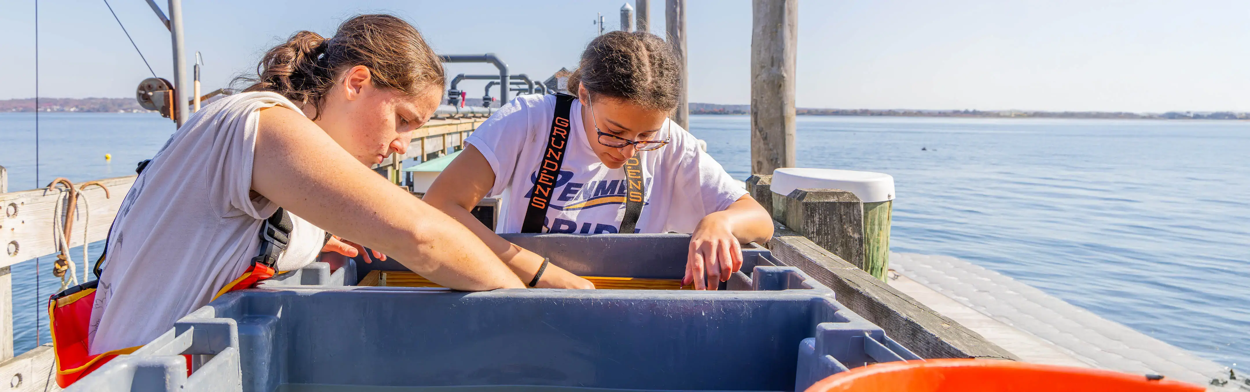 Two students work on RWU's learning dock